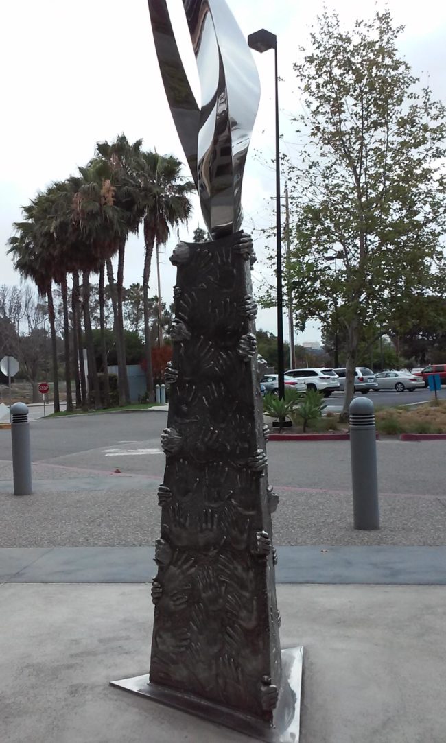 These hands look like trapped souls trying to escape -- what's more disturbing is that this is right outside of a medical building.