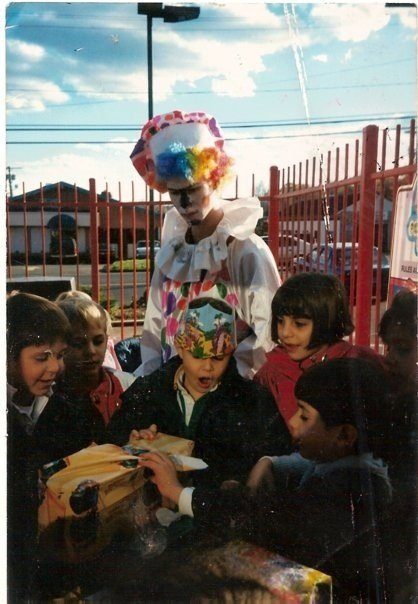 These kids are totally oblivious to the horrifying sight peering over their shoulders.