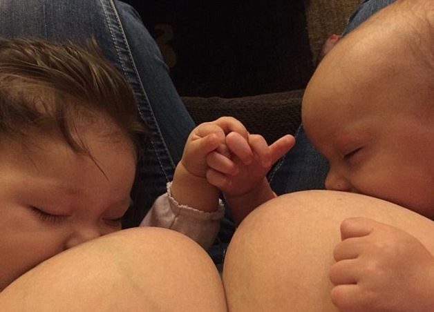 The two babies had never met before, but as they nursed in tandem, they interlocked their fingers in a sweet gesture of new friendship. Wanosik snapped a photo and shared it on Facebook.