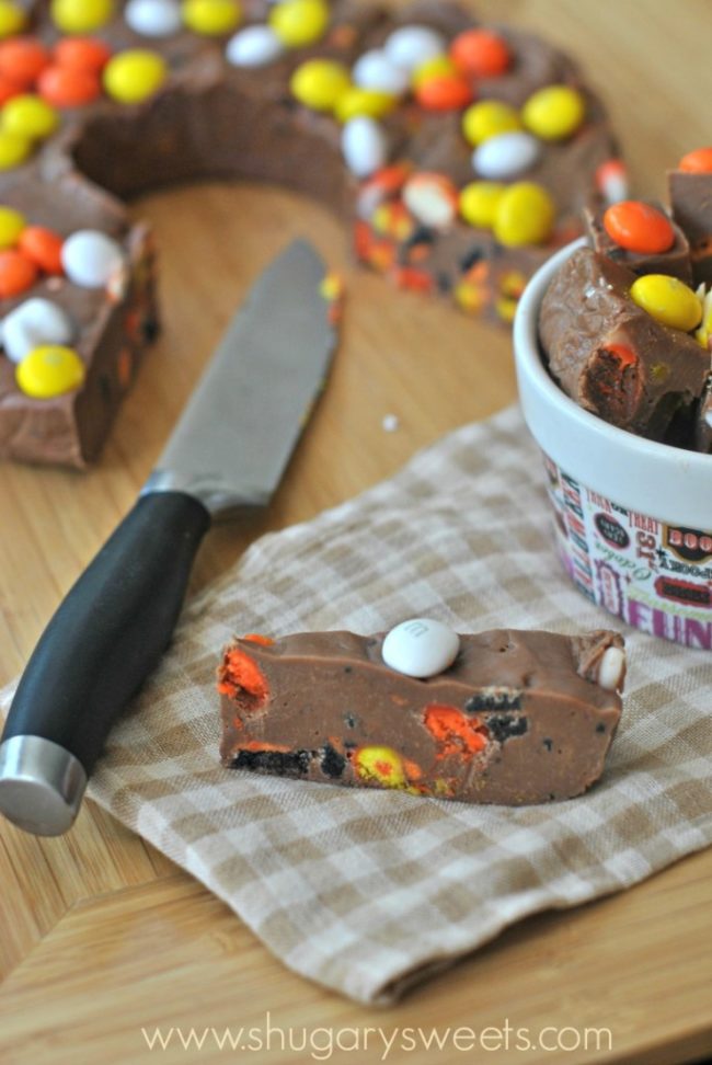 Top your favorite <a href="http://www.shugarysweets.com/2013/10/halloween-fudge-ring" target="_blank">fudge recipe</a> with some Halloween candies to bring the treat to the next level.