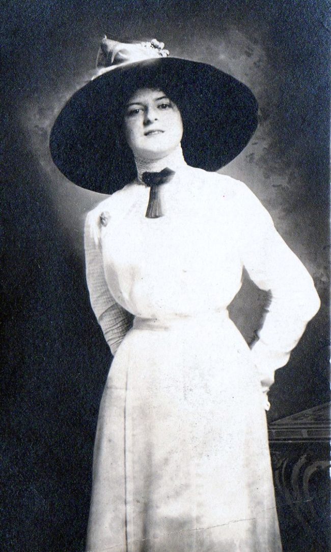 The woman appears to be wearing clothes that were in fashion long before the 1940s.  That dress style was popular anywhere from the late 1800s to around 1910.
