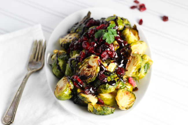 Doctoring up your <a href="http://www.platingsandpairings.com/roasted-brussels-sprouts-cranberries-balsamic-reduction/" target="_blank">Brussels sprouts</a> with some cranberries will give both vegetarians and meat eaters a delectable side dish.