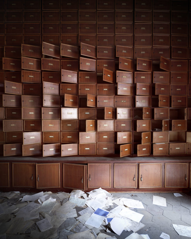 The open drawers and scattered papers might not seem like much -- at least until you realize that this is the administrative block of an abandoned asylum in Italy.