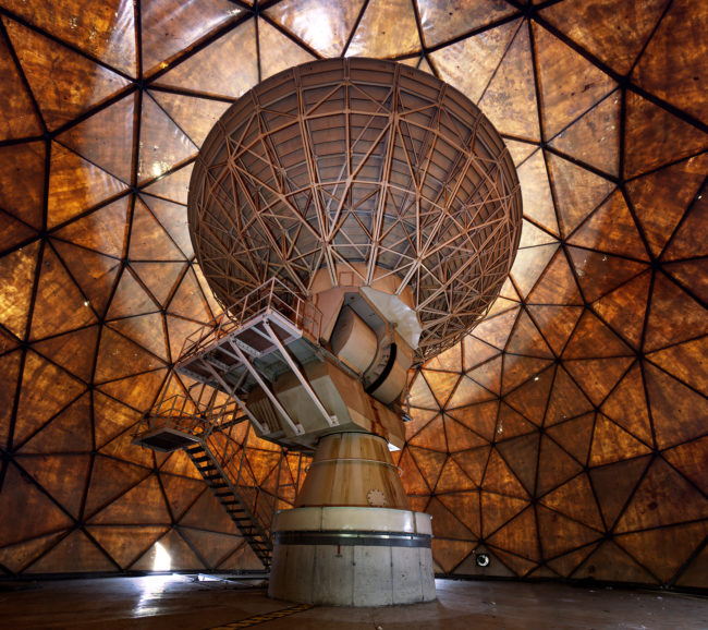 The photographer was lucky enough to sneak inside the stunning geodesic dome of an old radio antenna right before it was demolished.