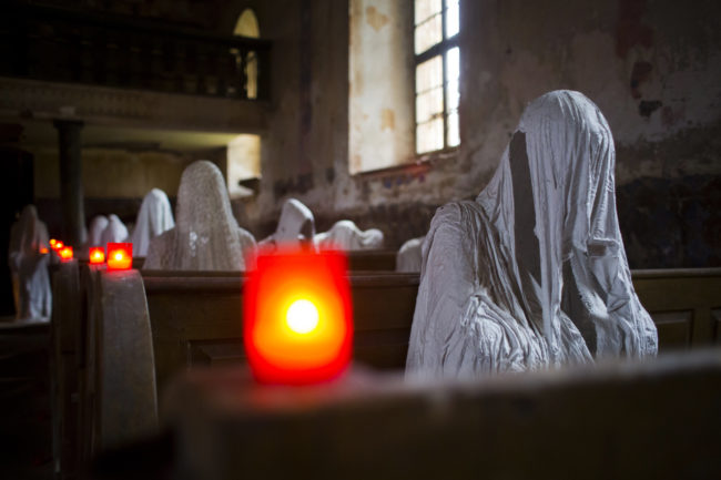 Hadrava made the ghosts by dipping fabric in plaster, then allowing it to dry in the shape of a hooded human figure. 