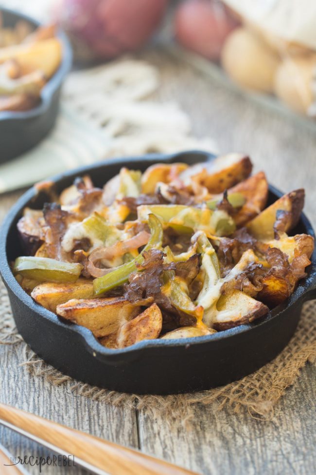 These french fries are all the deliciousness of a <a href="http://www.thereciperebel.com/skillet-philly-cheesesteak-potato-wedges/" target="_blank">Philly cheesesteak</a> without the bun. 