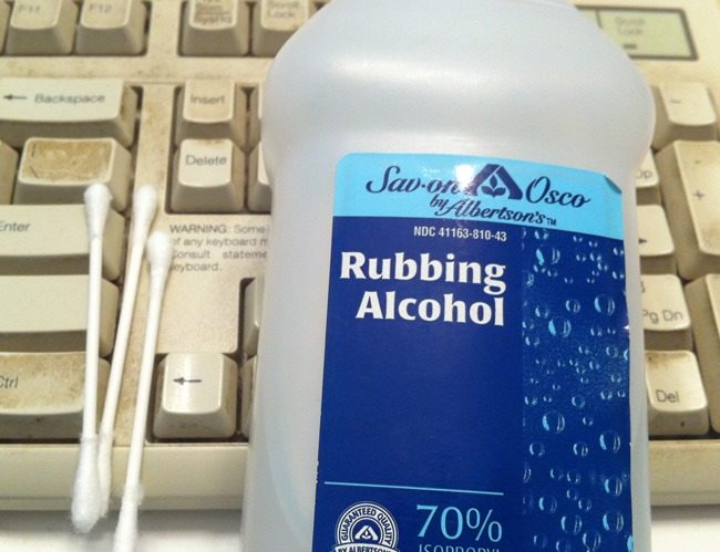 Get dirt and debris off your keyboard by using rubbing alcohol and Q-tips.