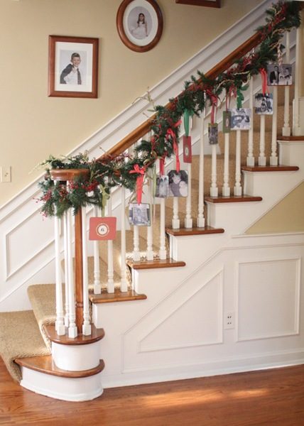 Or <a href="http://www.memoriesoncloverlane.com/2010/11/photo-garland.html" target="_blank">dress up the railing</a> on your stairs for the same effect.