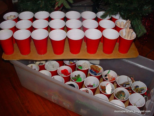 Plastic cups offer a cheap and effective way to store ornaments. For extra security, hot glue the cups to a piece of cardboard.