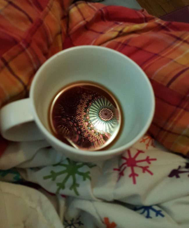 A simple cup of joe came to life when morning light streamed through a tapestry. 