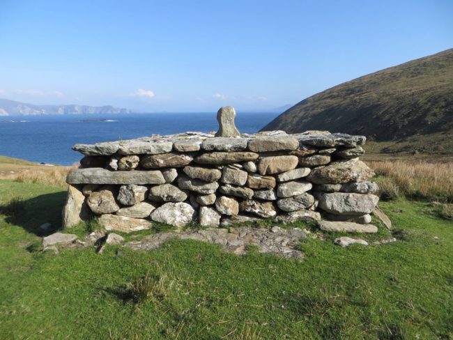 There were once more than 40 houses on Achill Island, but all that's left is mounds of dirt and foundation structures. 