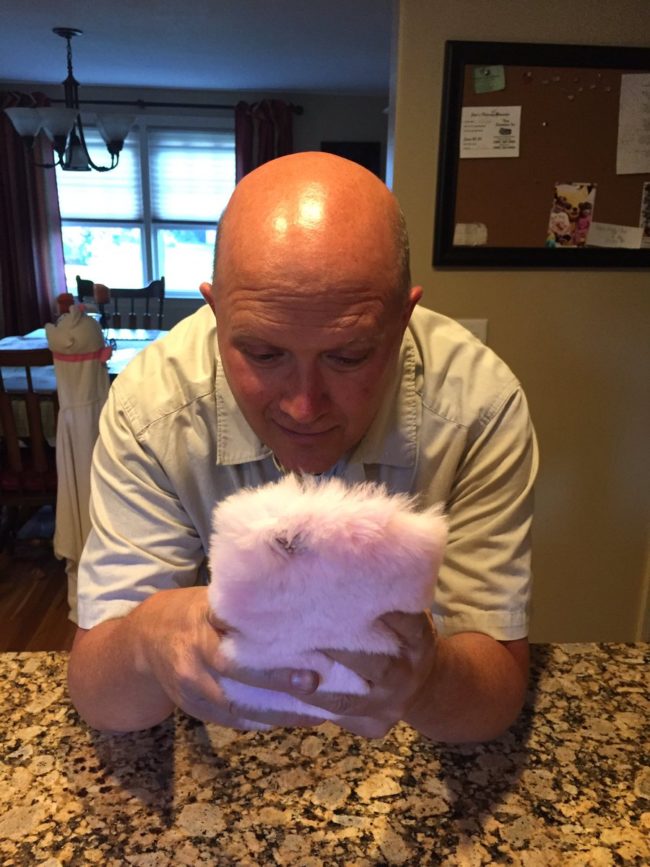 Her dad was the lucky recipient, and he seems totally delighted by the fuzzy phone cover. 