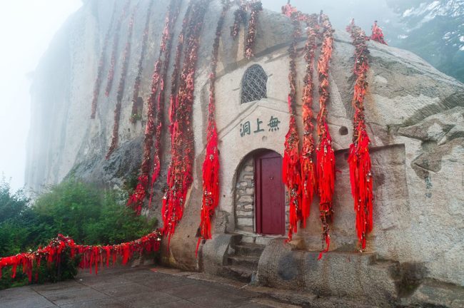   At the base of the summit lies a Daoist temple known as the Shrine of the Western Peak. 