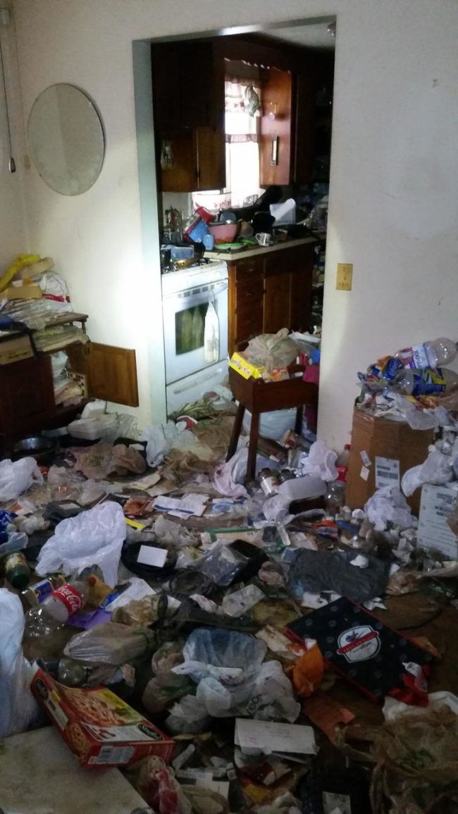 This is what the kitchen looked like at the start of the project. It was absolutely overflowing with trash. 