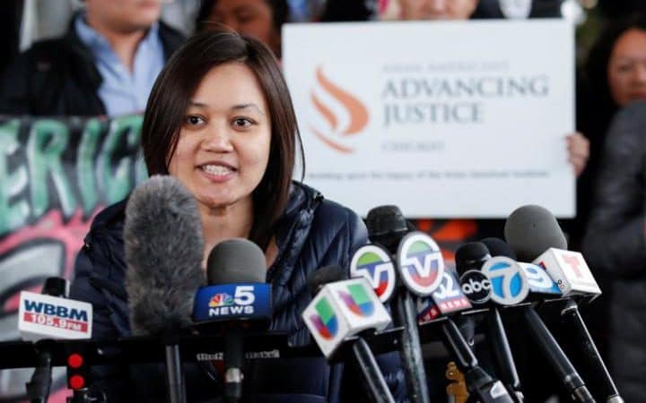 Tuyet M. Le, Executive Director of Asian American Advancing Justice, speaks during a protest of the treatment of Dr. David Dao